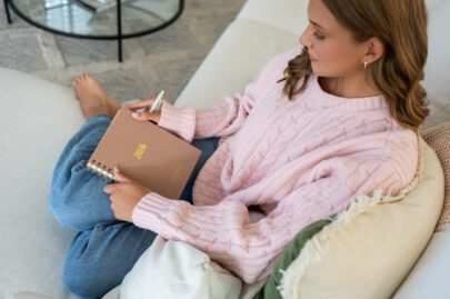 Girl praying with prayer journal