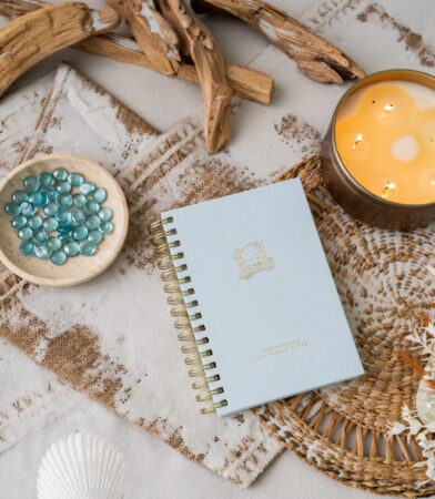 Val Marie Paper 2027 Signature prayer journal in Sky, a light blue with gold spiral binding and gold foil emblem